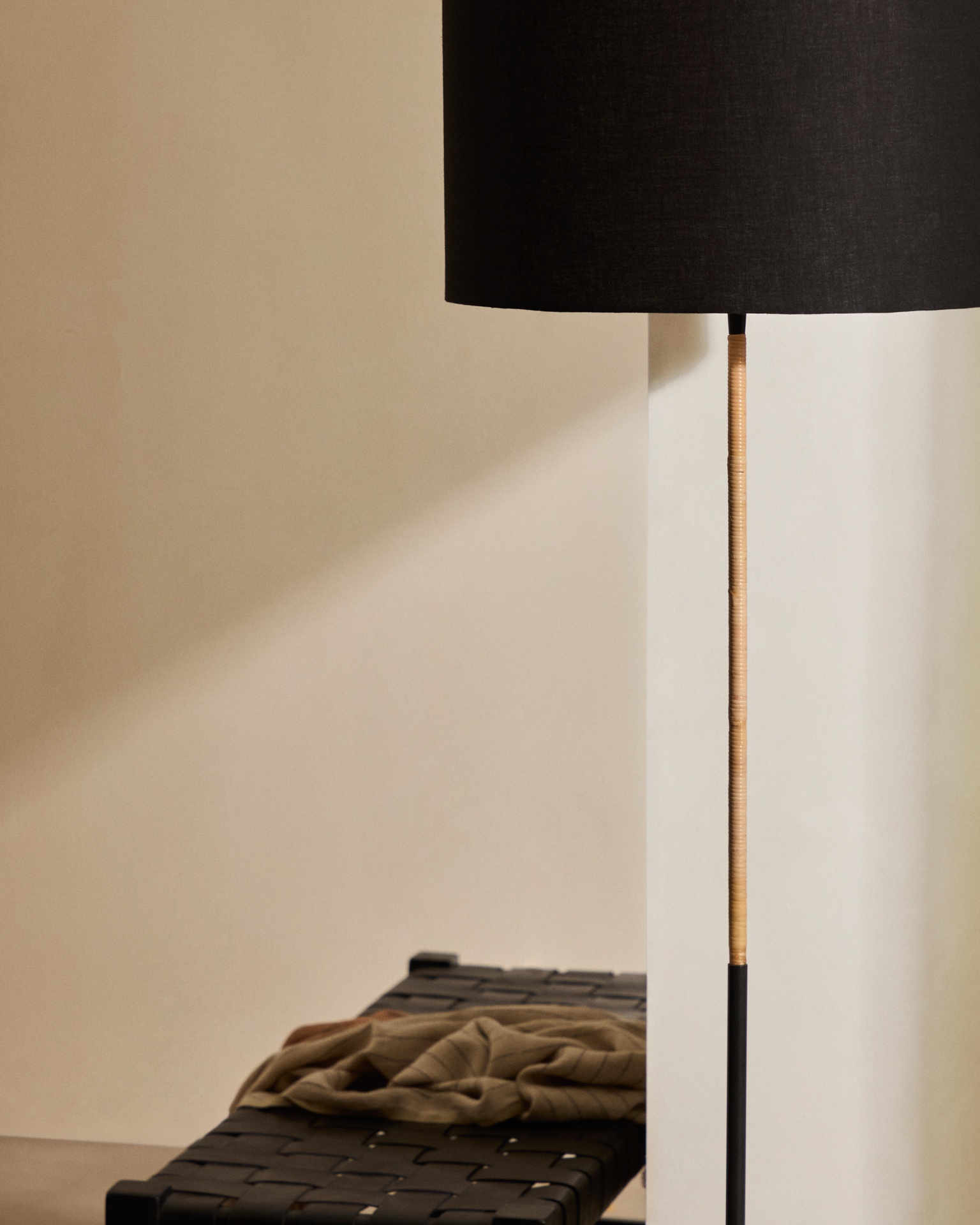 Canar metal and rattan floor lamp made with a black cotton lamp shade