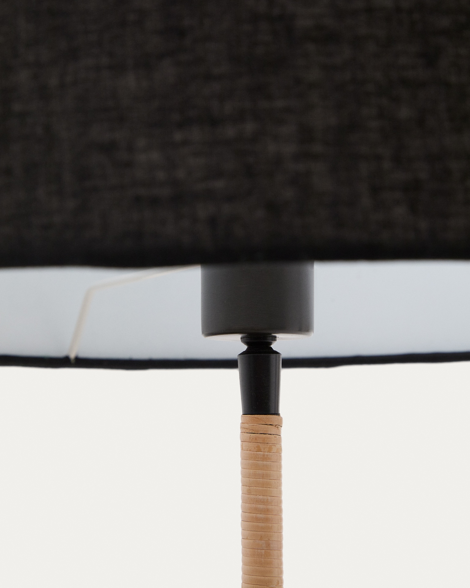 Canar metal and rattan floor lamp made with a black cotton lamp shade