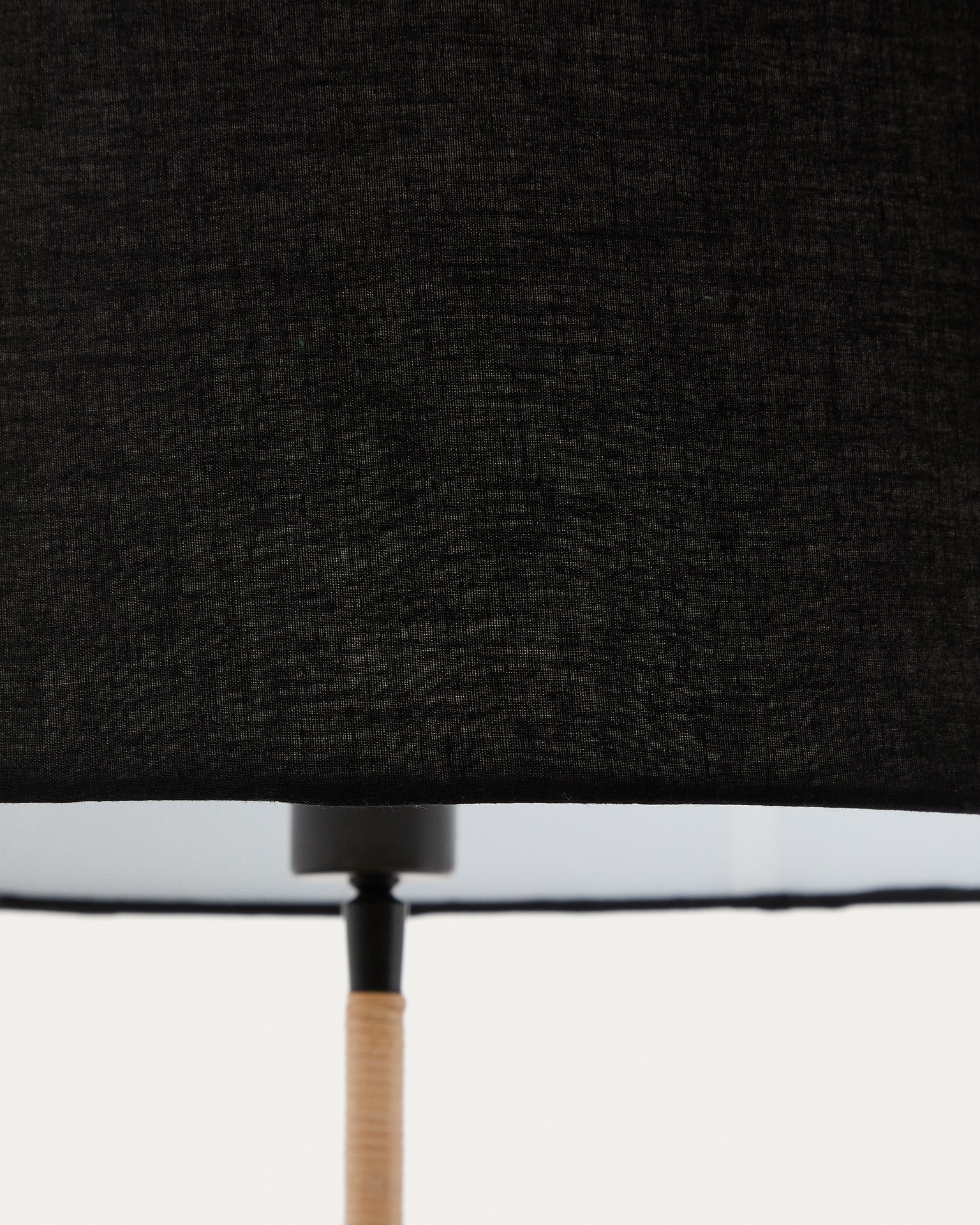 Canar metal and rattan floor lamp made with a black cotton lamp shade