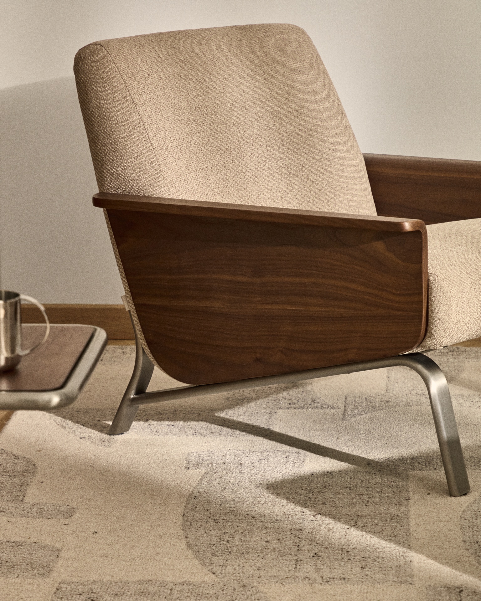 Amsen light brown armchair in walnut plywood with legs in brushed stainless steel FSC 100%