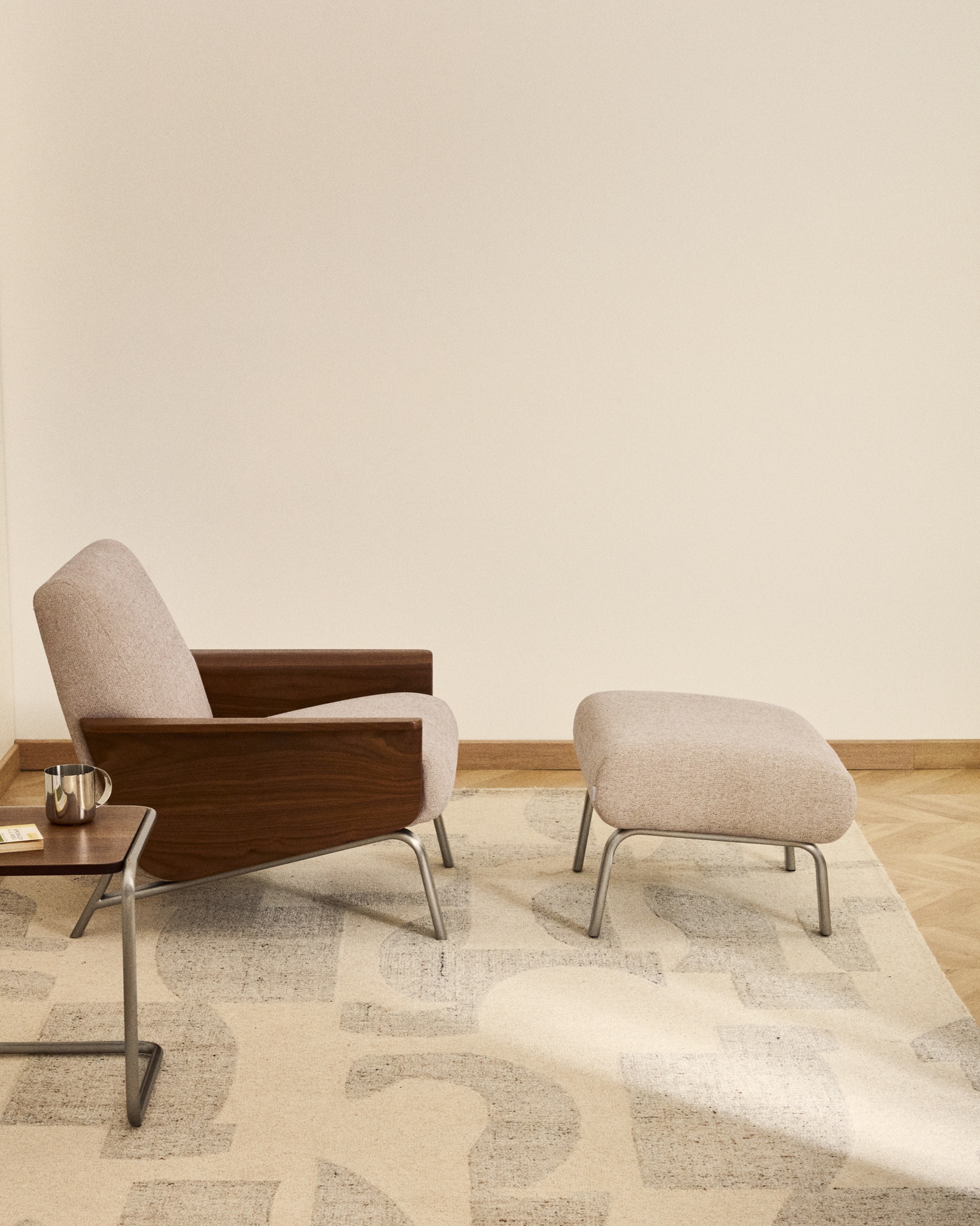 Amsen light brown armchair in walnut plywood with legs in brushed stainless steel FSC 100%