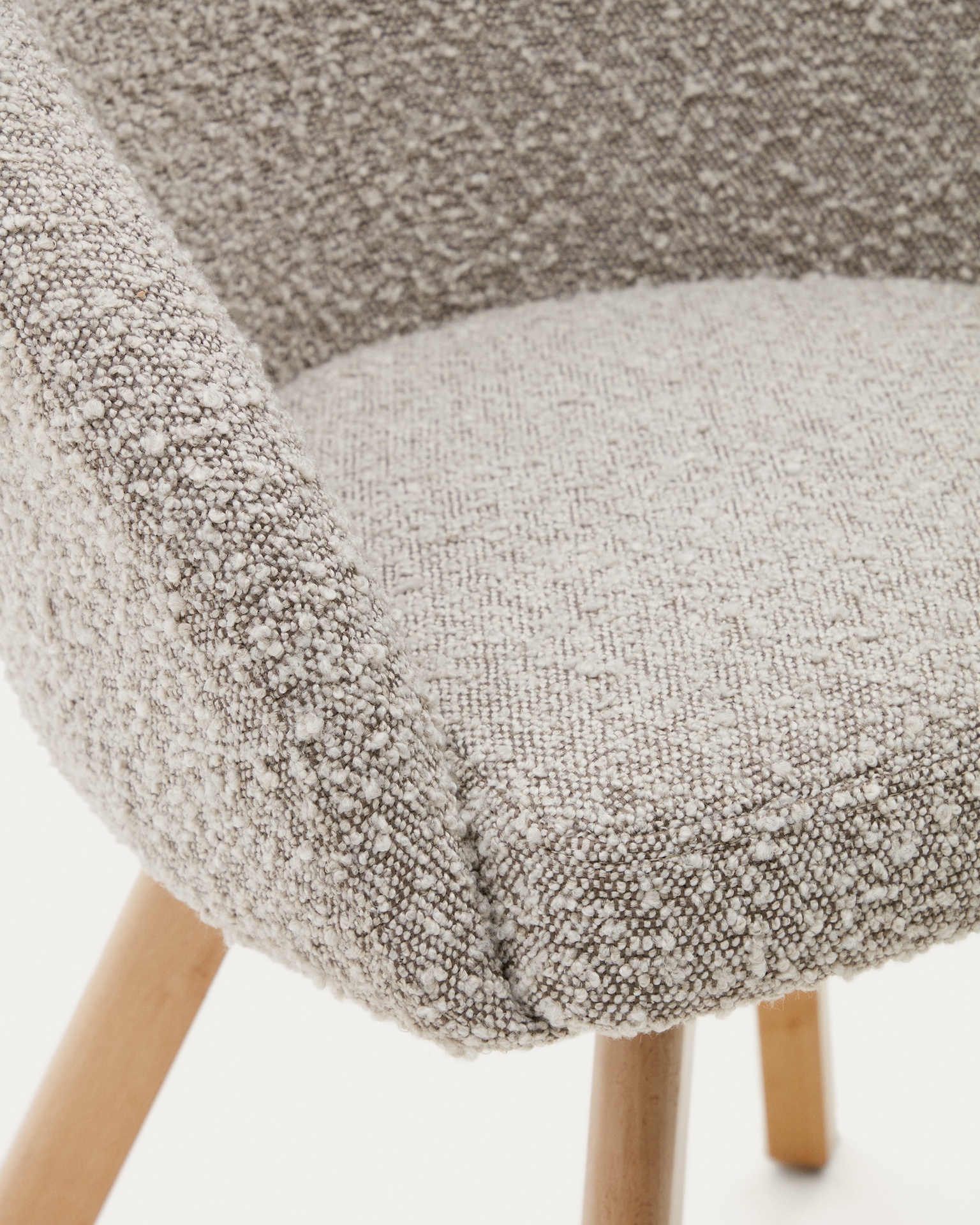 Marvin swivel chair with grey bouclé and beech wood legs in a natural finish FSC 100%