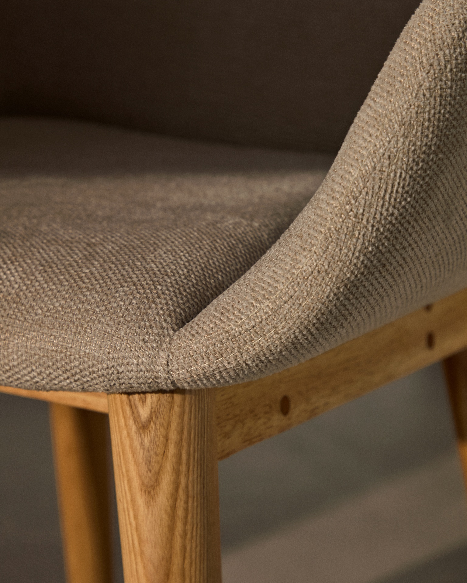 Konna chair in beige with solid ash wood legs in a natural finish