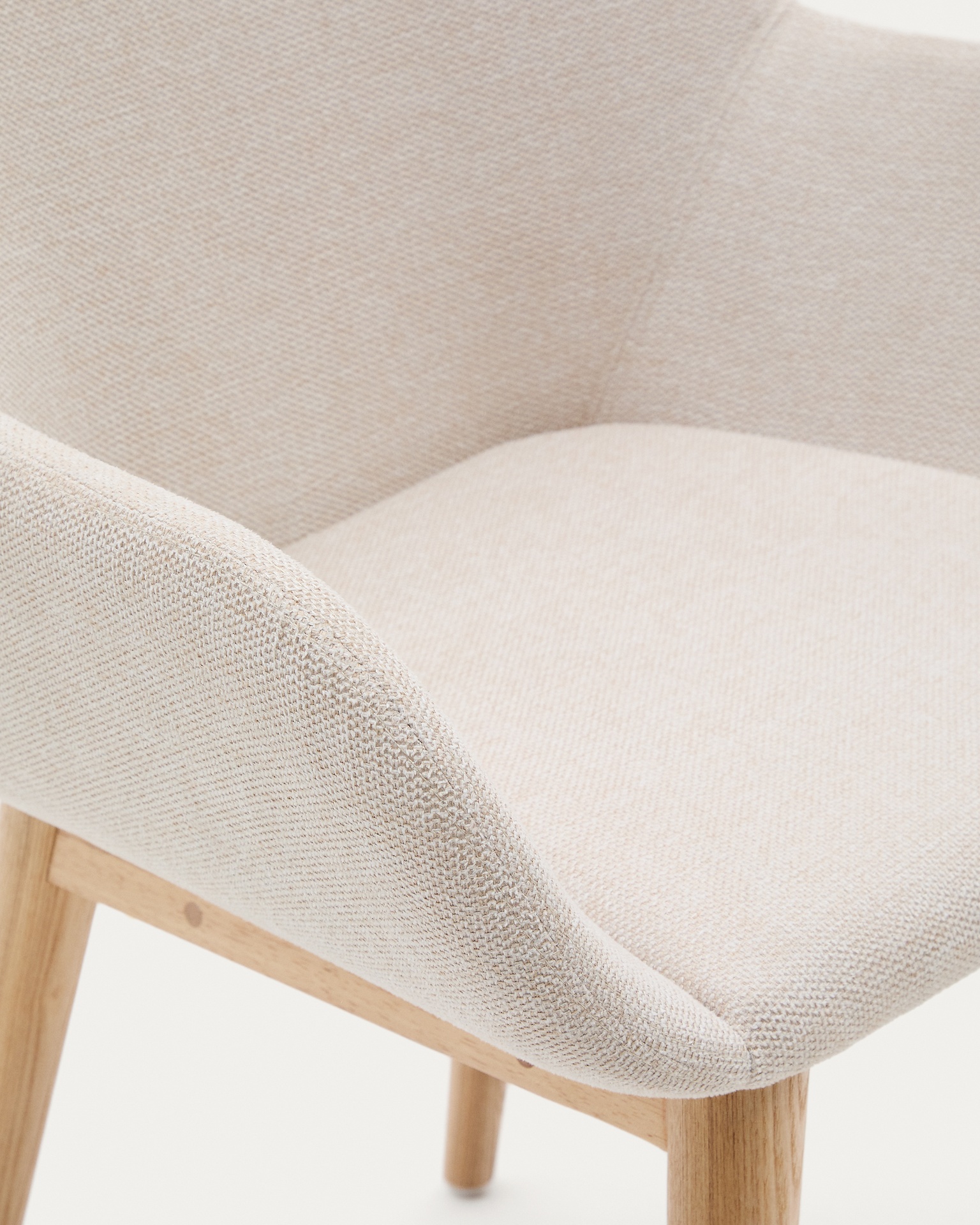 Konna chair in beige with solid ash wood legs in a natural finish