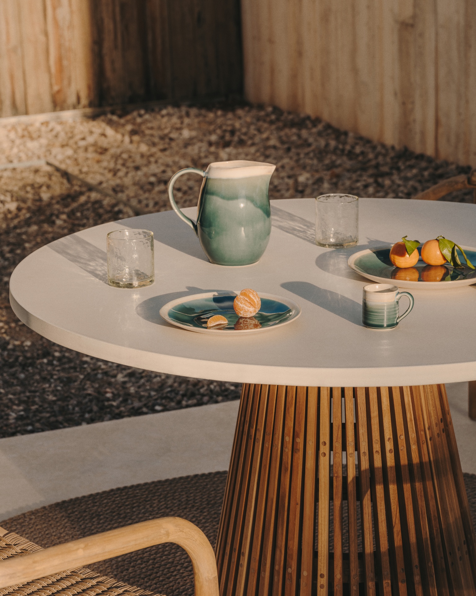 Alcaufar round outdoor table made of solid teak wood and grey cement Ø 120 cm